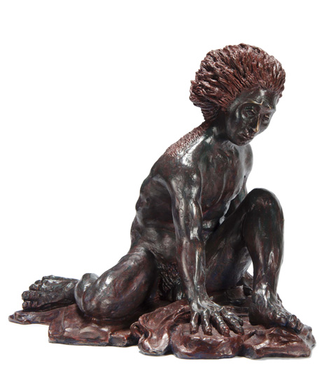 Front View: ENKIDU, the “wild man” companion of the Mesopotamian hero Gilgamesh; a crouching male figure, arms and legs extended, with hair like a lion’s pelt.