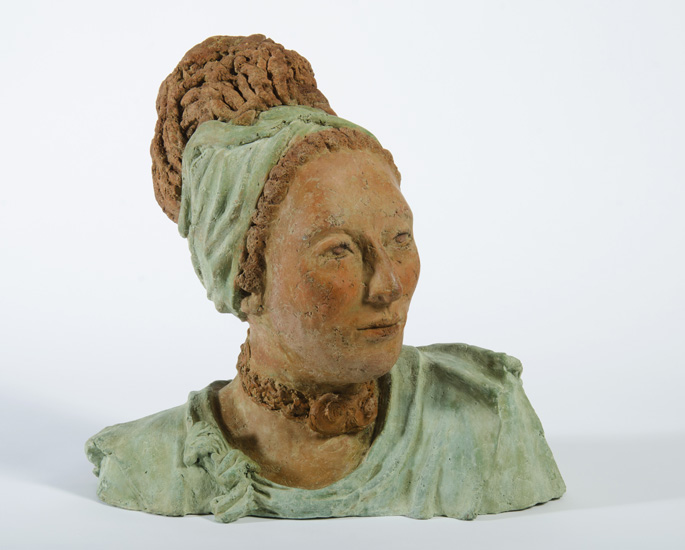 SHEBA, myhto-historical bust of a draped woman with headband and dreadlocks, head turned to the left. 